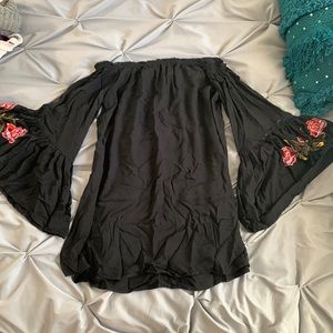 Black off the shoulder wide floral embroidered sleeve.